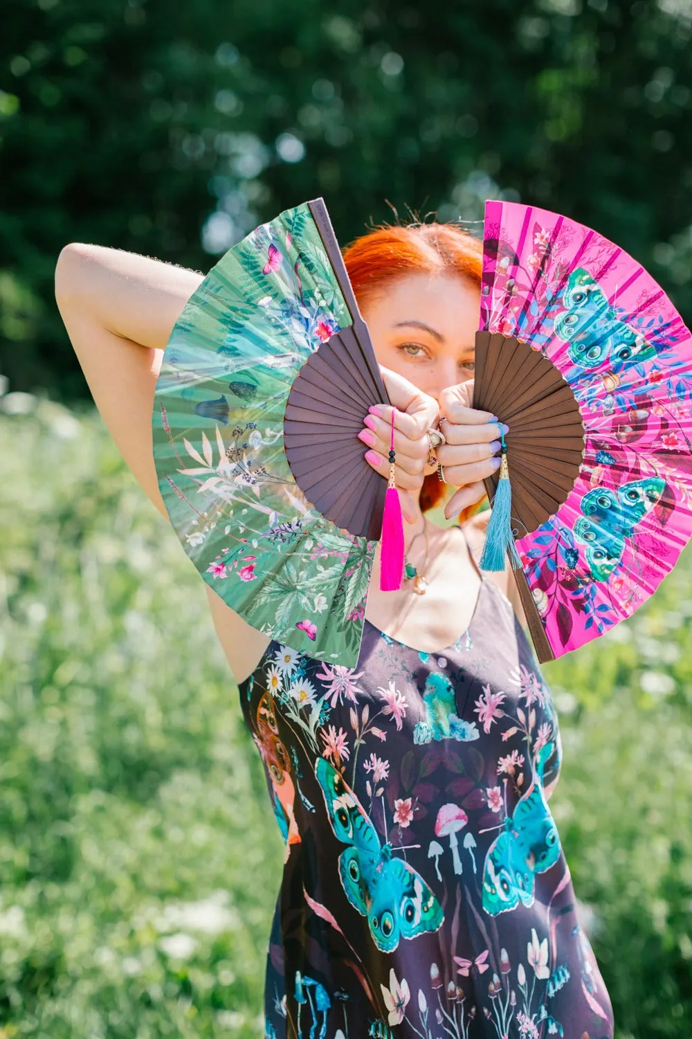 Green hand-held silk fan with 'Greenery' mushroom and crystal botanical artwork